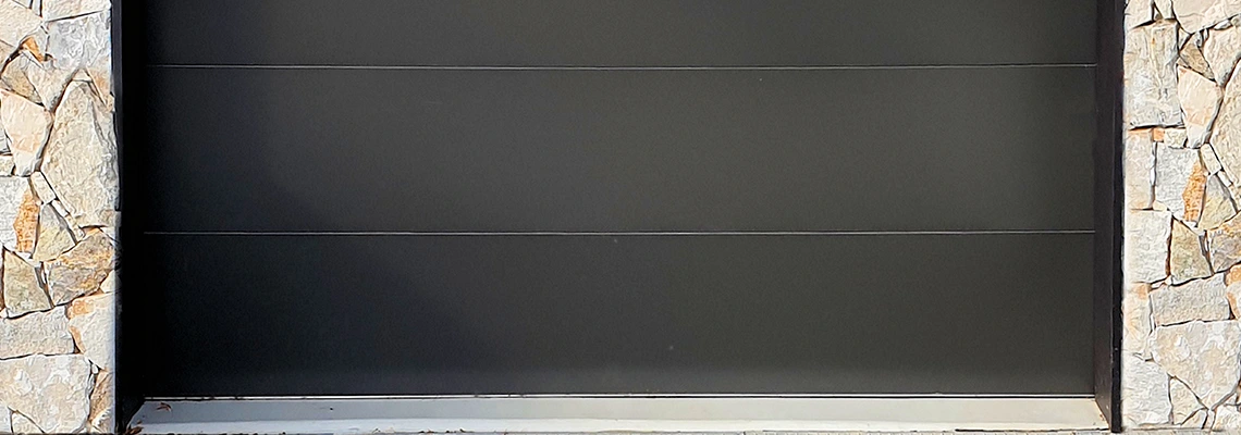 Overhead Black Garage Door Installation in South Miami Heights, Florida